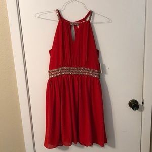 Beautiful red dress with pretty detailing!